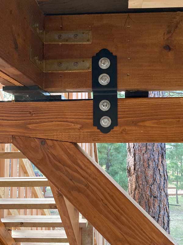 Special connectors protect the trees from movement of the treehouse